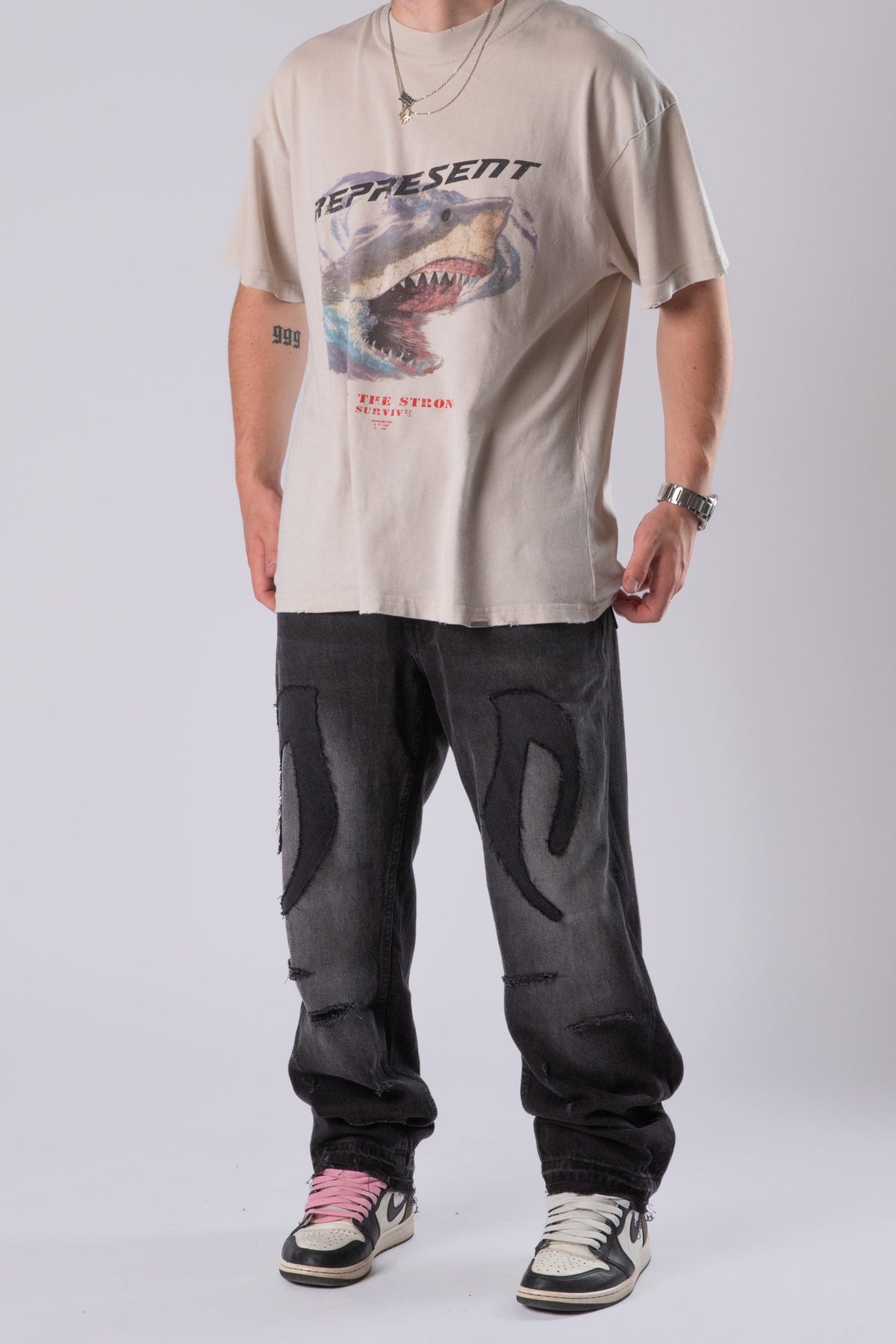 DISTRESSED TRIBAL JEANS