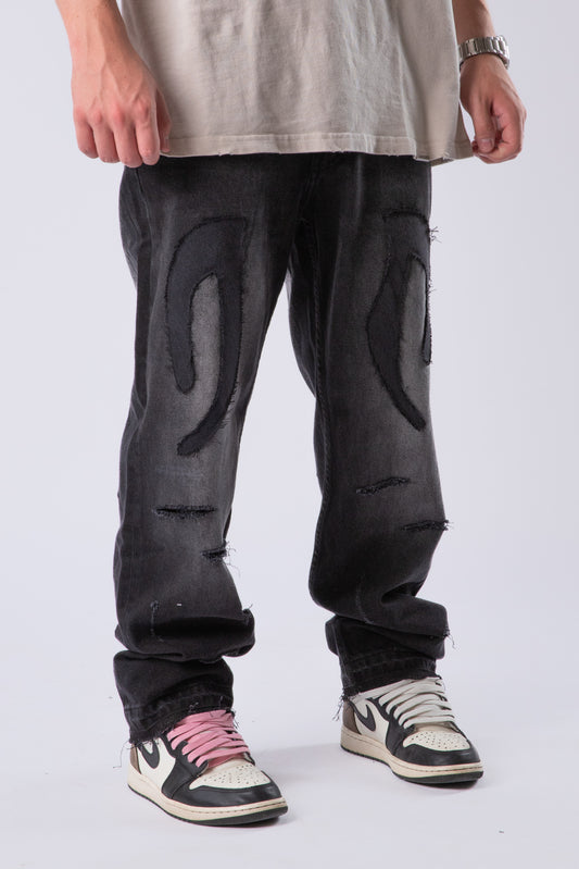 DISTRESSED TRIBAL JEANS