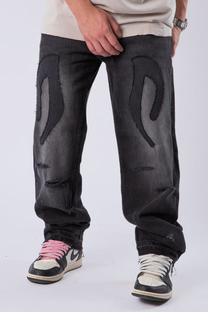 DISTRESSED TRIBAL JEANS